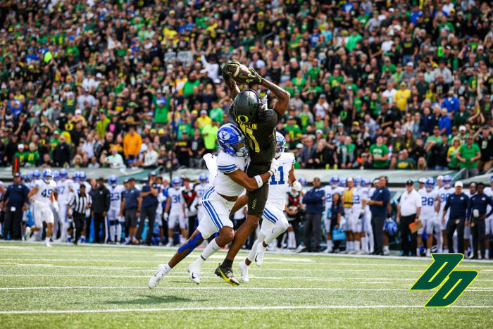 Oregon wide receiver Troy Franklin hauls in a deep pass from Bo Nix in a game against the BYU Cougars.
